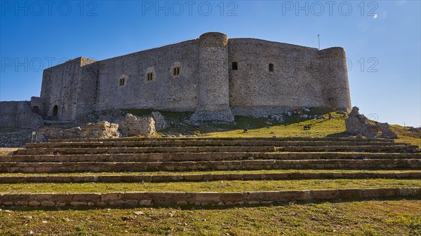 Ruins of a castle with pre-stages, surrounded by green grass, under a bright blue sky, Chlemoutsi, High Medieval Crusader Castle, Kyllini Peninsula, Peloponnese, Greece, Europe