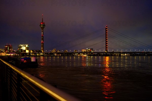 View over the Rhine with television tower and bridge, night shot, Duesseldorf, Germany, Europe