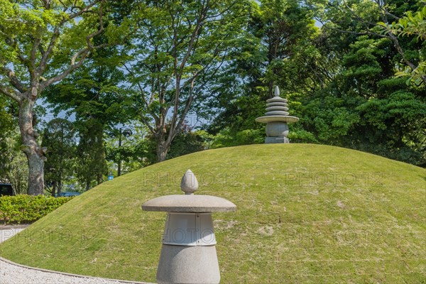 Round stone carved pagoda on hilltop in Hiroshima Peace Park in Hiroshima, Japan, Asia