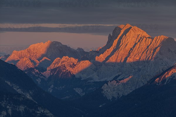 Distant view of steep mountains in the evening light, clouds, autumn, view from Wank to Karwendel Mountains, Werdenfelser Land, Upper Bavaria, Bavaria, Germany, Europe