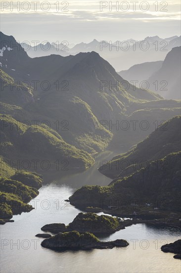 Fjord landscape with atmospheric evening light, Ulvagfjorden fjord and mountains, view from the top of Dronningsvarden or Stortinden, Vesteralen, Norway, Europe