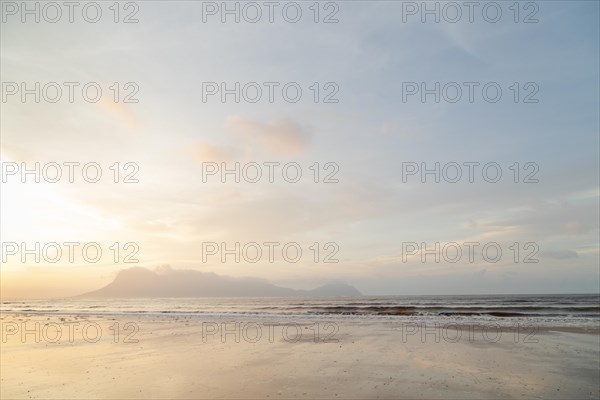 Bako national park, sea sandy beach, overcast, cloudy sunset, sky and sea, low tide. Vacation, travel, tropics concept, no people, Malaysia, Kuching, Asia