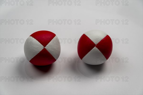 Two juggling balls in front of a white background, studio shot, Germany, Europe