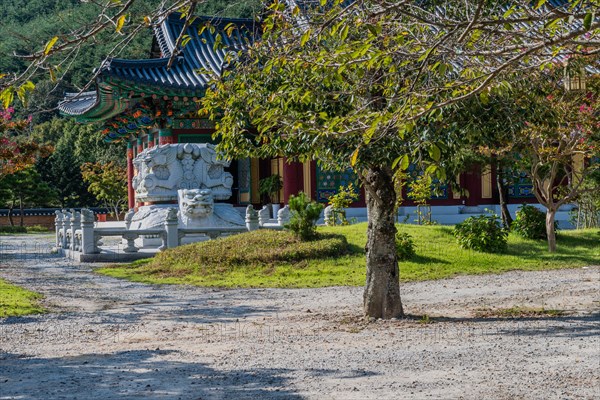 Rock carved dragons atop turtle in front of temple building at temple in Gimje-si, South Korea, Asia