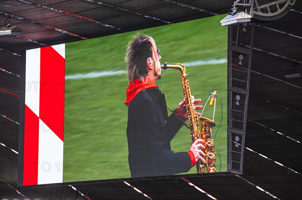 Saxophonist Noah fisherman plays at the memorial service, funeral service of FC Bayern Munich for Franz Beckenbauer, Allianz Arena, Froettmaning, Munich, Upper Bavaria, Bavaria