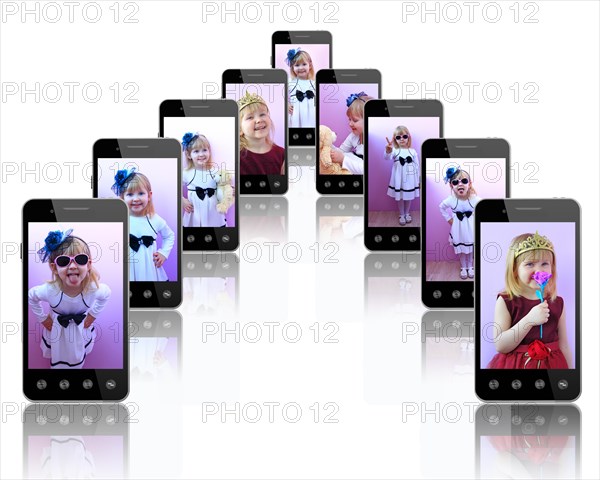Smartphone with photo of beautiful girl. Mobile phones with images of little fashionable girl. Modern communications. Digital technologies