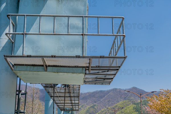 Gangplank over gantry hoist of hoist deck on spillway of local dam