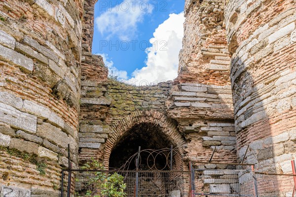 Entrance archway into ruins of ancient castle built between two towers in Istanbul, Tuerkiye