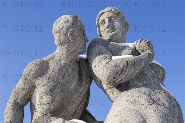 Snow-covered sandstone figures from Greek mythology at the historic water tower in Mannheim, Baden-Wuerttemberg, Germany, Europe