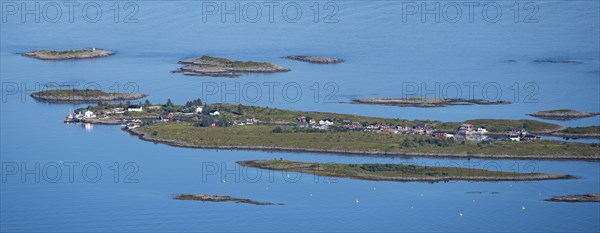 Rocky islands with colourful houses, sea with archipelago islands, Ulvagsundet, Vesteralen, Norway, Europe