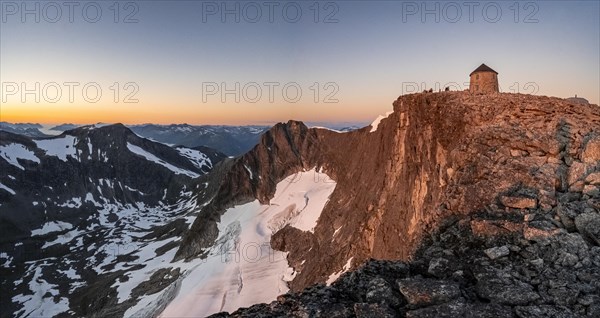 Summit of Skala with DNT's Skalatarnet mountain hut, at sunset, Loen, Norway, Europe