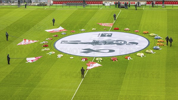 Flags of the FC Bayern fan clubs lie on the pitch in honour of Franz Beckenbauer, banner with Franz Beckenbauer and wreaths of flowers, funeral service of FC Bayern Munich for Franz Beckenbauer, Allianz Arena, Froettmaning, Munich, Upper Bavaria, Bavaria