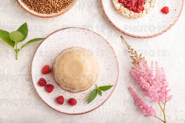 Buckwheat milk jelly on gray concrete background. top view, flat lay