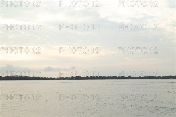 Lombok and Gili Air islands, overcast, cloudy day, sky and sea. Vacation, travel, tropics concept, no people. Sunset, sand beach