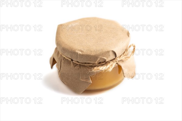 Glass jar with honey isolated on white background. side view, close up