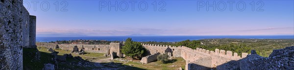 Panoramic picture, fortress walls of an old castle with a view of the sea and the blue sky, Chlemoutsi, high medieval crusader castle, Kyllini peninsula, Peloponnese, Greece, Europe