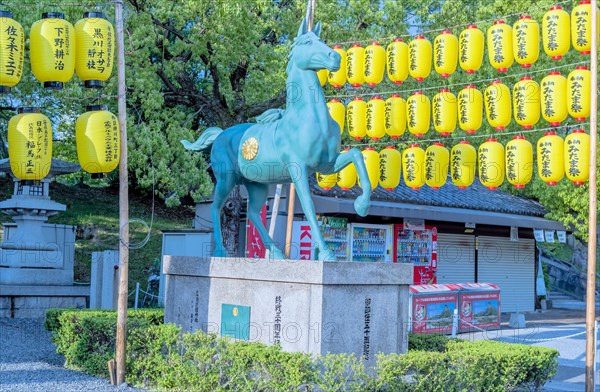 Statue of horse on concrete plinth at Shinto shrine in Hiroshima, Japan, Asia