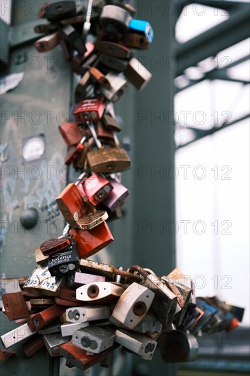 Love locks on a bridge over the Rhine, blurred background, Cologne, Germany, Europe