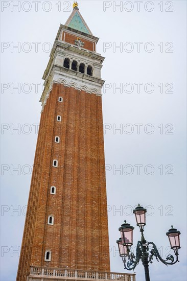 Bell Tower (Campanile di San Marco) in St. Mark Square, famous tourist attraction in Venice, Italy, Europe