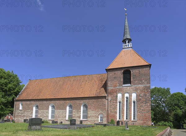 Exterior view of the Evangelical Reformed Church of Krummhoern-Rysum, Germany, Europe