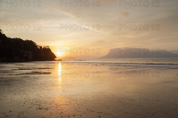 Bako national park, sea sandy beach, overcast, cloudy sunset, sky and sea, low tide. Vacation, travel, tropics concept, no people, Malaysia, Kuching, Asia