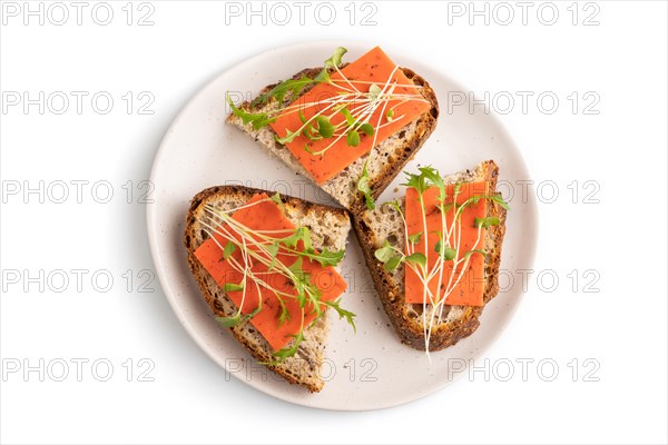 Grain bread sandwiches with red tomato cheese and mizuna cabbage microgreen isolated on white background. top view, flat lay, close up