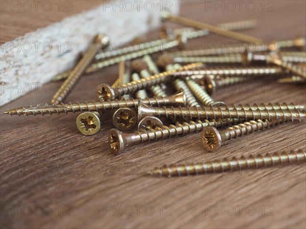 Wood screws on manufactured wood panel