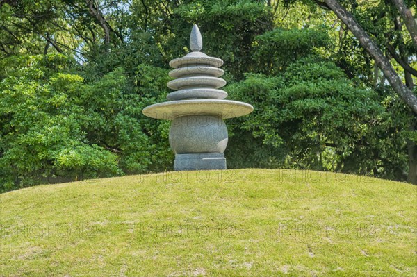 Round stone carved pagoda on hilltop in Hiroshima Peace Park in Hiroshima, Japan, Asia