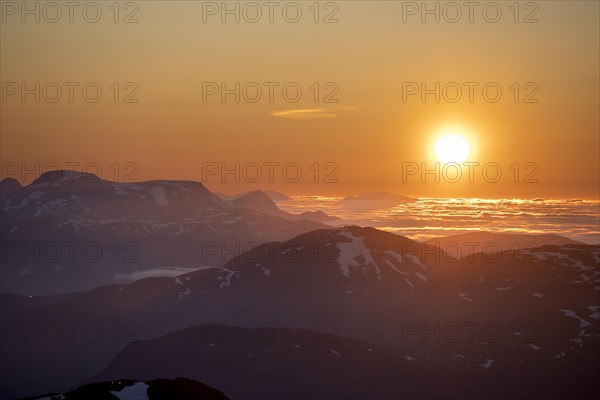 Sun setting behind the mountains, mountain panorama from the summit of Skala, Loen, Norway, Europe