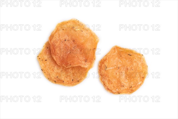 Slices of dehydrated salted meat chips isolated on white background. Top view, flat lay, close up