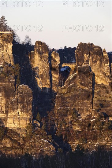 View from the Rauenstein to the Bastei rocks, winter evening, Saxony, Germany, Europe