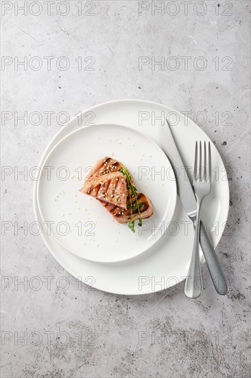 Portion of grilled ahi tuna steak on a plate