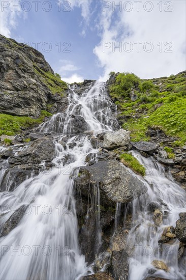 Waterfall on a mountainside, long exposure, Berliner Hoehenweg, Zillertal Alps, Tyrol, Austria, Europe