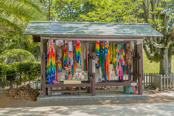 Origami steamers hanging in wooden shelter at Peace Memorial Park in Hiroshima, Japan, Asia