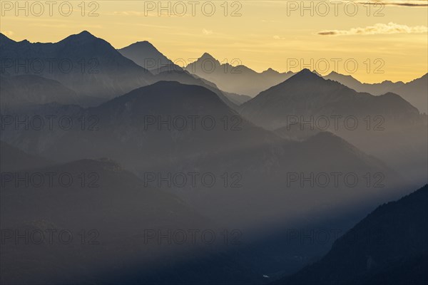 Silhouette of a mountain peak in the evening light, haze, backlight, Ammergau Alps, Upper Bavaria, Bavaria, Germany, Europe