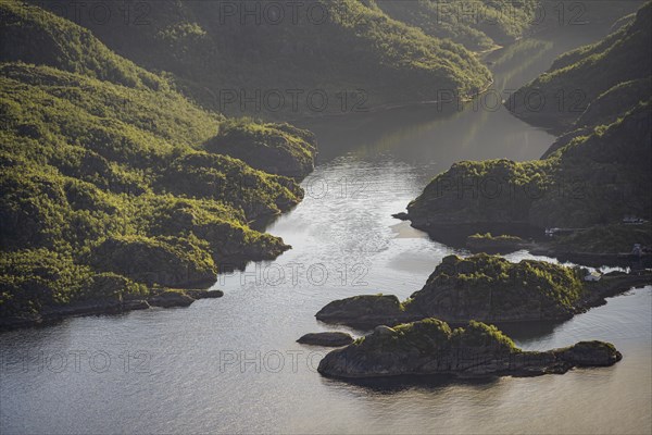 Fjord landscape with atmospheric evening light, Ulvagfjorden fjord and mountains, view from the top of Dronningsvarden or Stortinden, Vesteralen, Norway, Europe