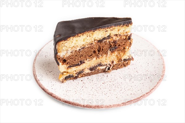 Chocolate biscuit cake with caramel cream isolated on white background. side view
