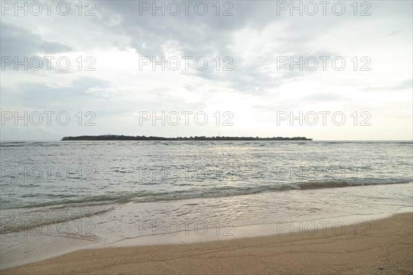 Lombok and Gili Air islands, overcast, cloudy day, sky and sea. Vacation, travel, tropics concept, no people. Sunset, sand beach