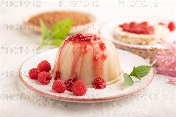 Buckwheat milk jelly on gray concrete background. side view, selective focus