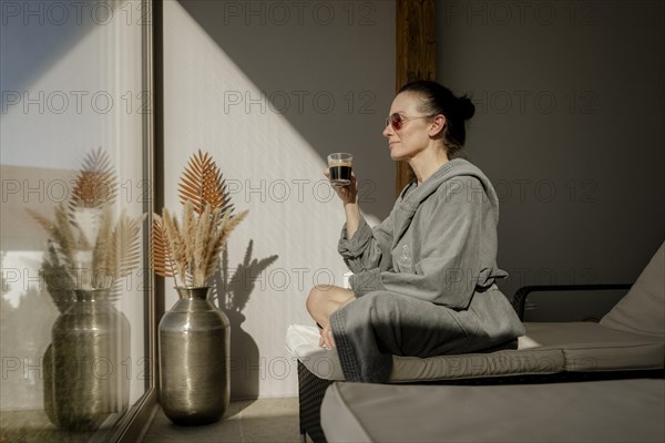 Woman enjoying coffee at a wellness centre