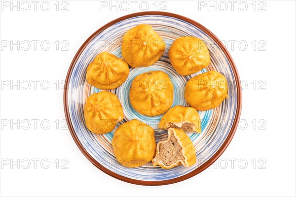 Fried manti dumplings isolated on white background. Top view, flat lay, close up