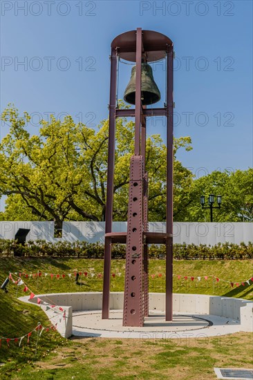 Metal bell tower in urban park in Hiroshima, Japan, Asia