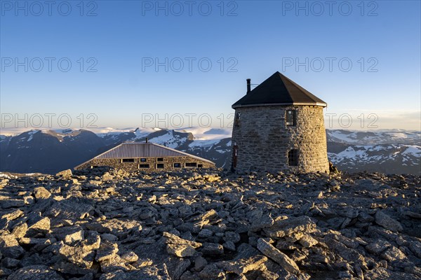 DNT's old and new mountain huts Skalatarnet at sunset, mountains with Jostedalsbreen glacier in the background, summit of Skala, Loen, Norway, Europe