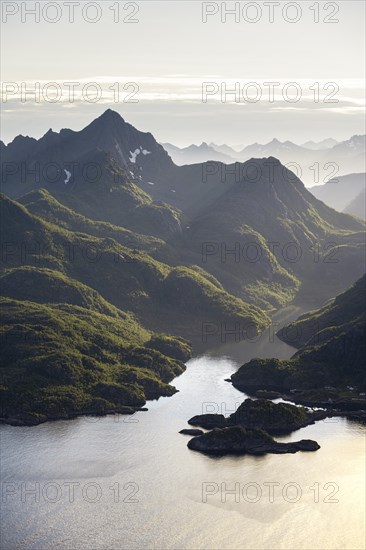 Fjord landscape with atmospheric evening light, Ulvagfjorden fjord and mountains, view from the top of Dronningsvarden or Stortinden, Vesteralen, Norway, Europe