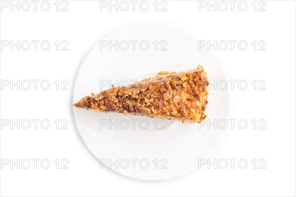 Walnut and hazelnut cake with caramel cream isolated on white background. top view, flat lay