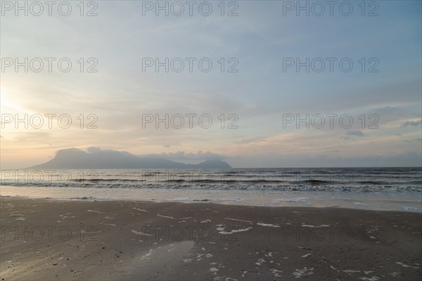 Bako national park, sea sandy beach, overcast, cloudy sunset, sky and sea, low tide. Vacation, travel, tropics concept, no people, Malaysia, Kuching, Asia