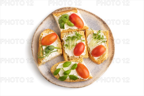 White bread sandwiches with cream cheese, tomatoes and microgreen isolated on white background. top view, flat lay, close up