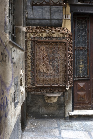 18th century Madonna and Child, protected by a wrought iron grille, in the historic centre, Al civ. 11 r. di Vico cinque Lampadi, Genoa, Italy, Europe