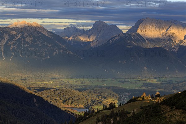 Distant view of steep mountains in the evening light, clouds, autumn, view from Wank to Karwendel Mountains, Werdenfelser Land, Upper Bavaria, Bavaria, Germany, Europe
