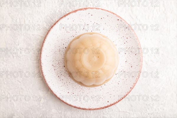 Buckwheat milk jelly on gray concrete background. top view, flat lay, close up